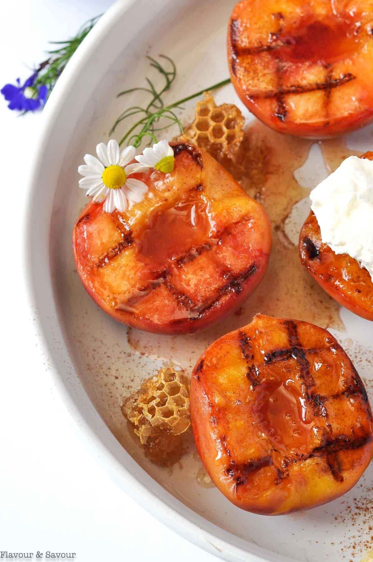 Close up view of peaches with honeycomb.