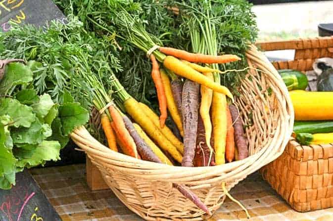 Rainbow carrots in a wicker basket to make Roasted Carrots with Honey-Mustard Glaze 