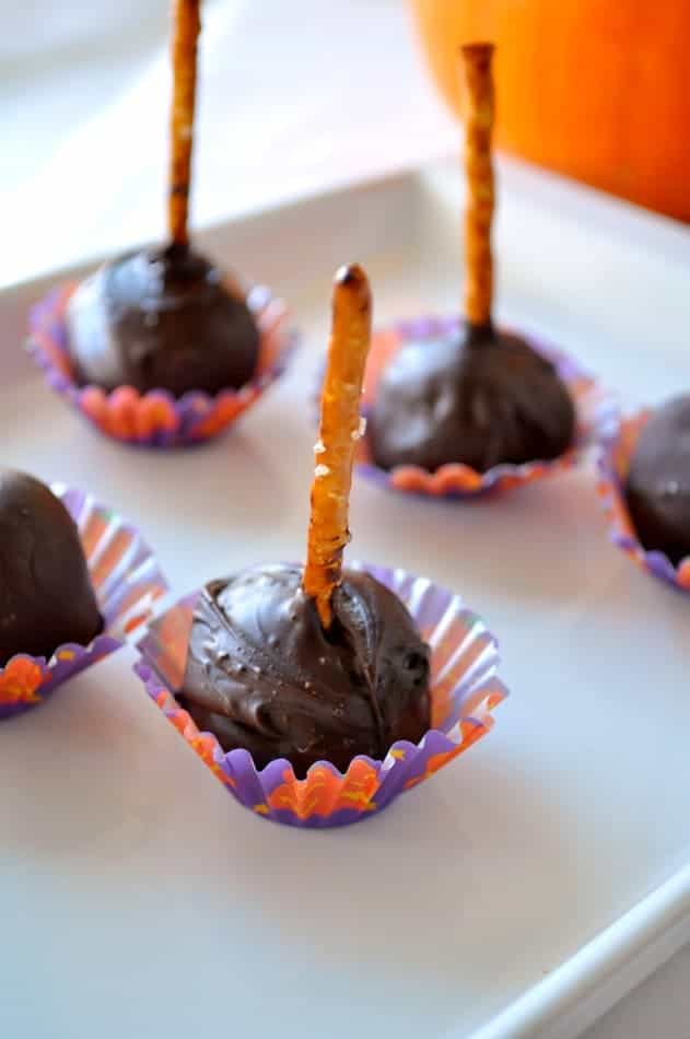 Chocolate Coconut Pops on pretzel sticks in Halloween themed mini muffins liners