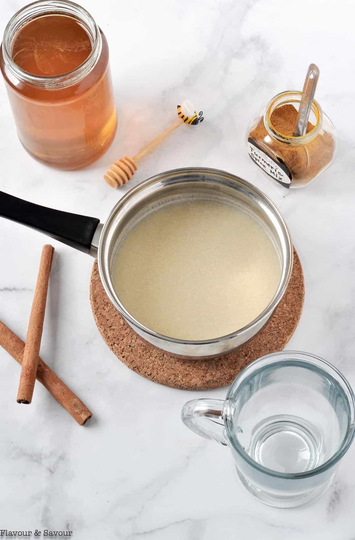 Saucepan and ingredients for Golden Milk