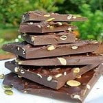 Salted Dark Chocolate Bark with Pumpkin Seeds stacked on a plate