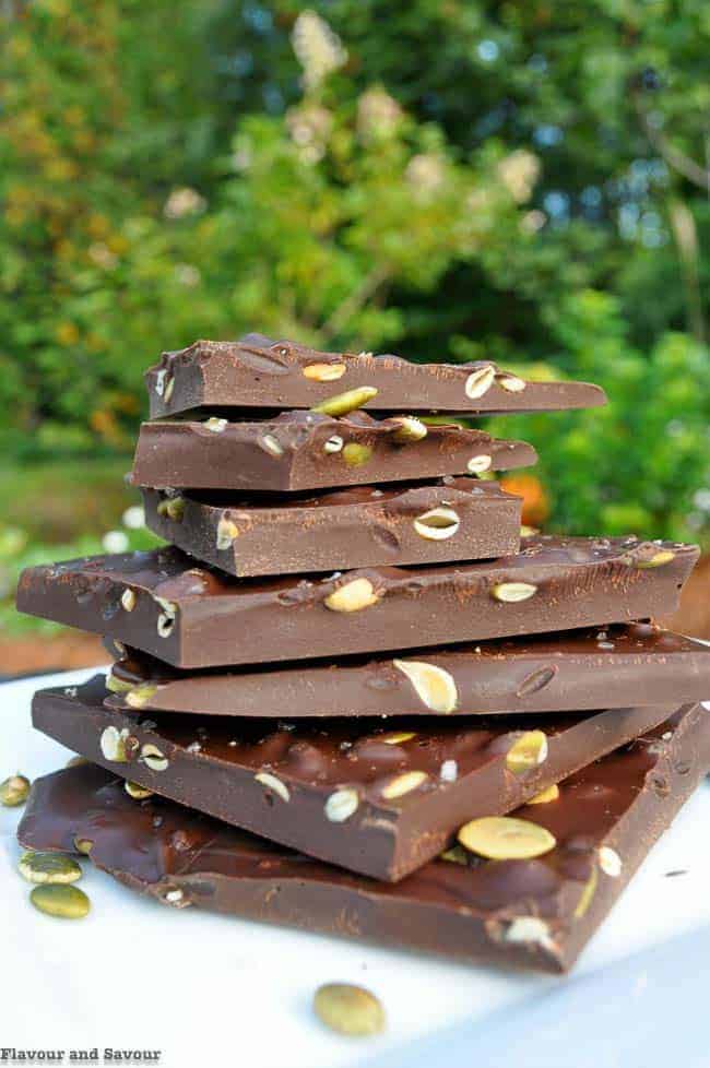 Salted Dark Chocolate Bark with Pumpkin Seeds stacked on a plate