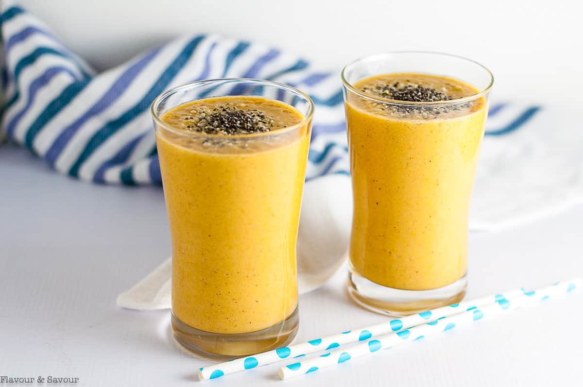 Two glasses of mango tropical turmeric smoothie