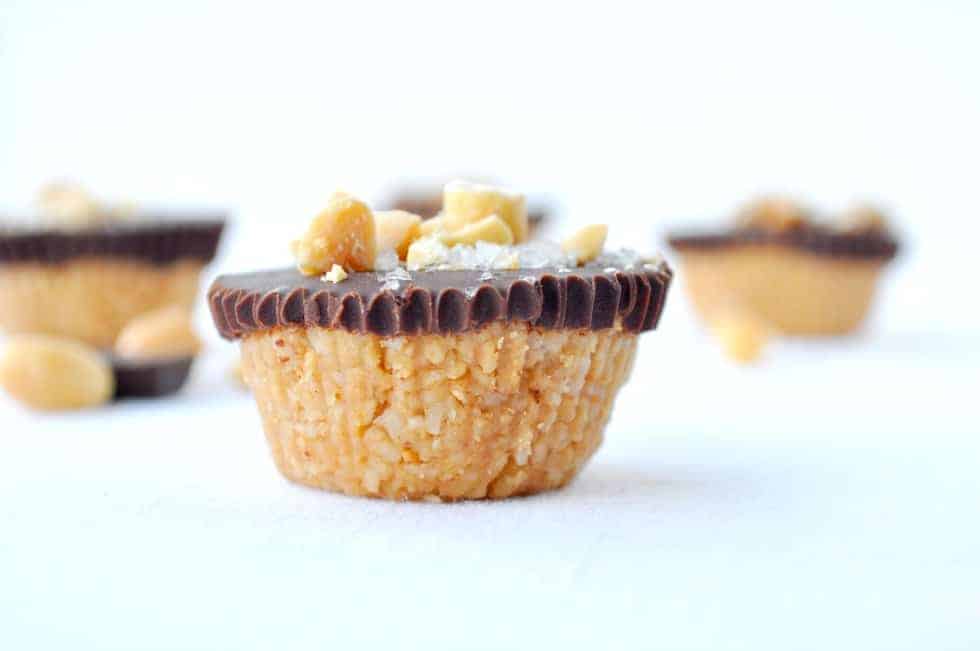 one chocolate peanut butter cups garnished with peanuts and flaky salt