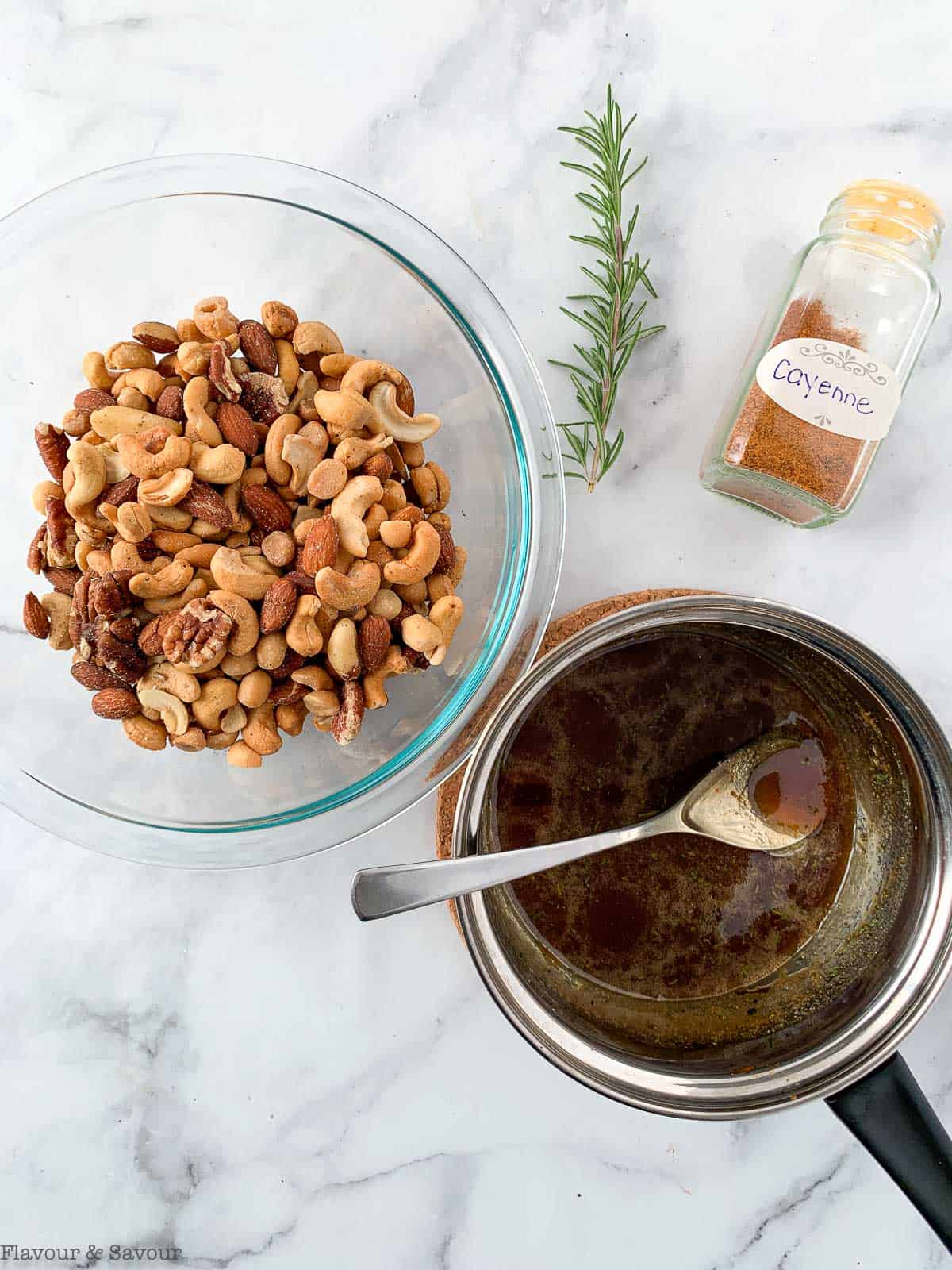 Sugar syrup, cayenne and a bowl of mixed nuts