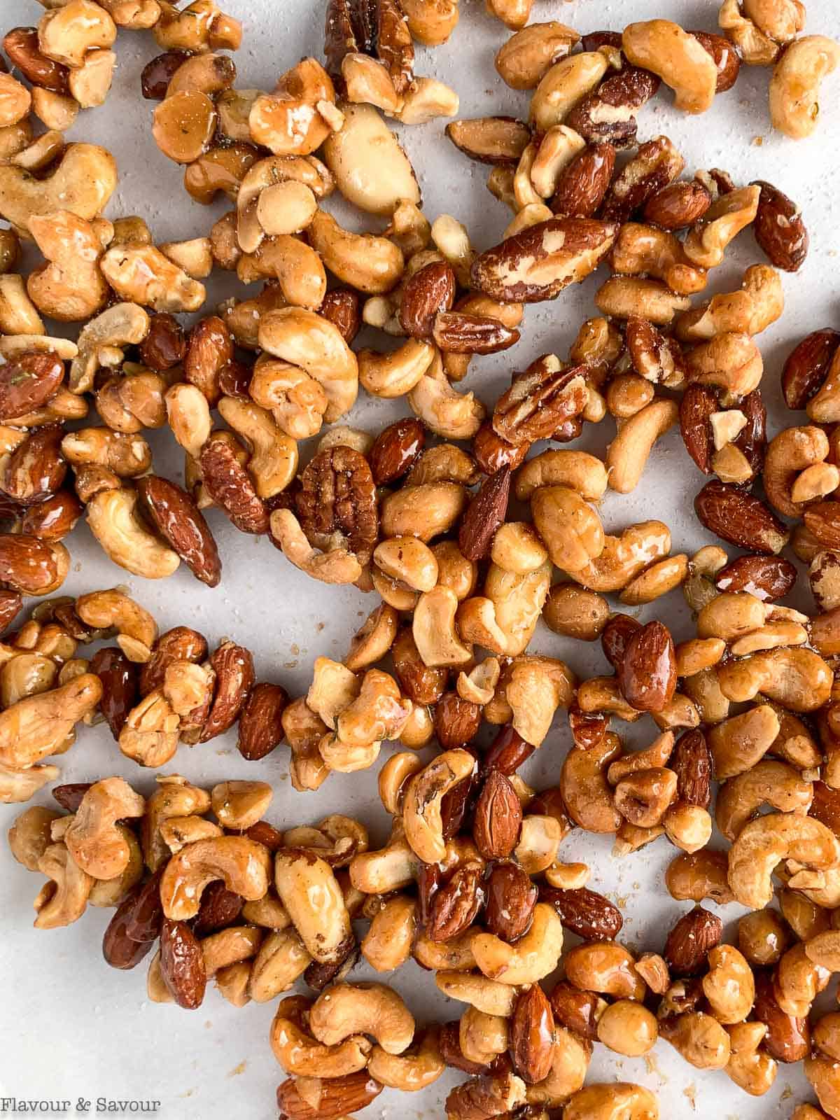 Sweet and Spicy Rosemary Nuts on a baking sheet