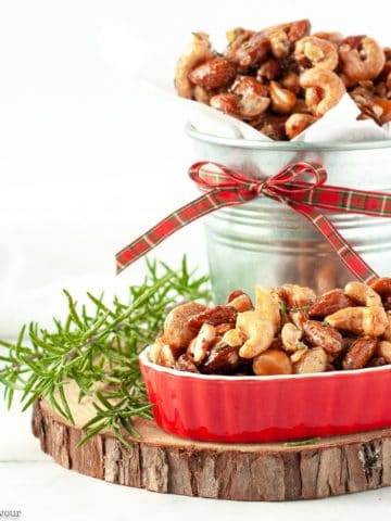 Sweet and Spicy Rosemary Nuts in a tin and in a red serving dish