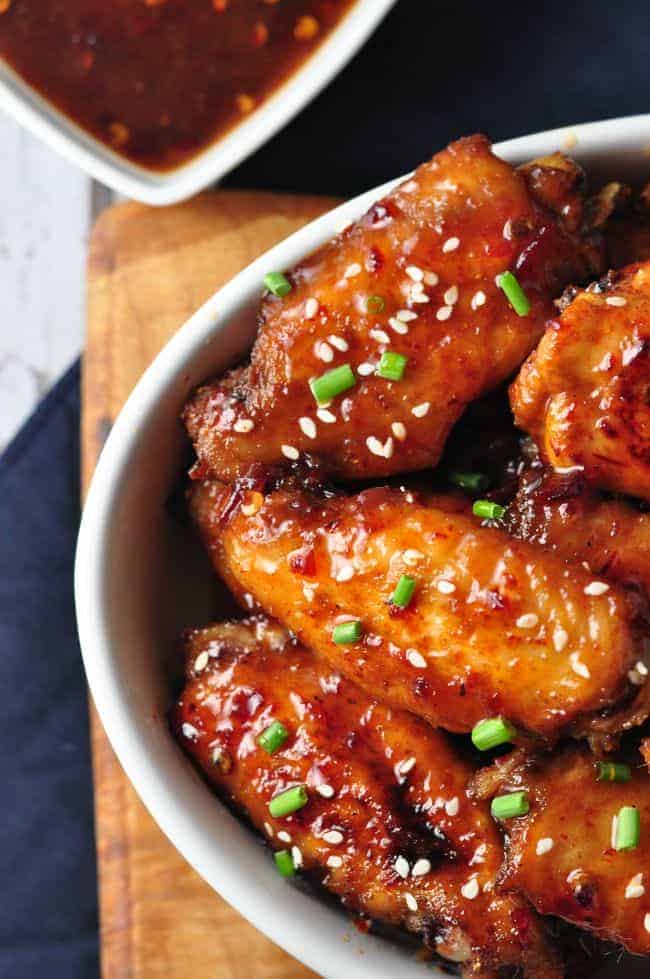 Chipotle Honey-Mustard Glazed Chicken Wings in a bowl with dipping sauce