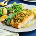 Baked Pistachio-Crusted Salmon with salad on gray plate