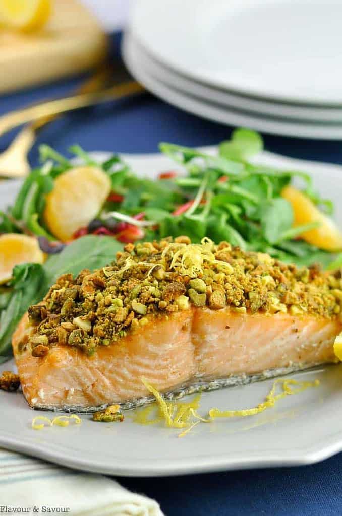 Close up view of Pistachio-Crusted Salmon on a dinner plate.