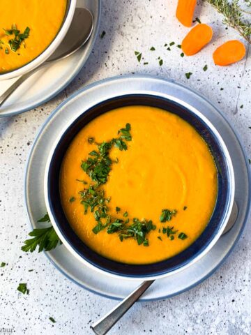 overhead view of a bowl of carrot ginger soup