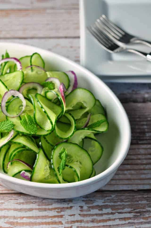 Cucumber Mint Salad with Red Onion and Thai Dressing. Sweet red onions and a flavourful Thai dressing turn plain cucumbers into something fancy. This Cucumber Mint Salad is ready in less than 10 minutes! An easy spring salad. |www.flavourandsavour.com