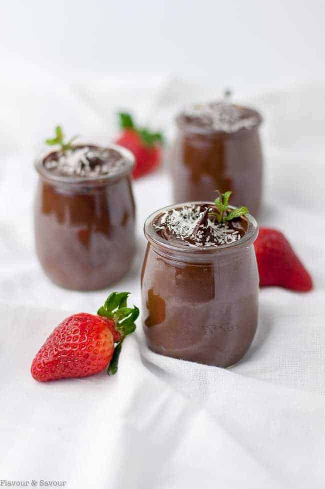 Dairy-Free Creamy Vegan Chocolate Mousse in tiny pots with strawberries.