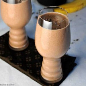 Two glasses of chocolate almond smoothie.