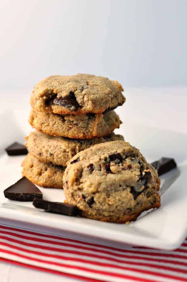 Grain-Free Chocolate Chip Cookies stacked with chocolate chunks on a plate. Flavour and Savour