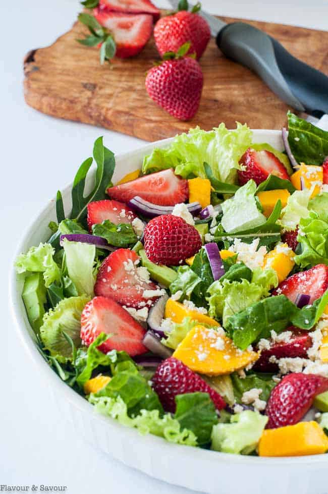 Close up view of Strawberry Mango Arugula Salad