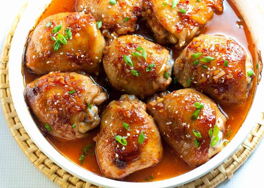 This Asian Glazed Garlic Chicken features tender, juicy chicken thighs glazed with an Asian-inspired sauce. It has a little heat and hints of garlic, sesame and ginger.|www.flavourandsavour.com