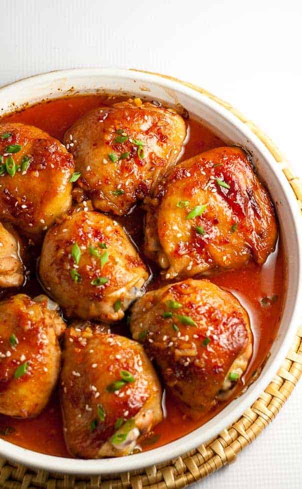 This Asian Glazed Garlic Chicken features tender, juicy chicken thighs glazed with an Asian-inspired sauce. It has a little heat and hints of garlic, sesame and ginger.|www.flavourandsavour.com