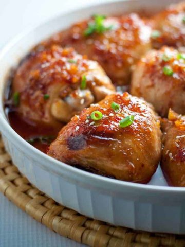 This Asian Glazed Garlic Chicken features tender, juicy chicken thighs glazed with an Asian-inspired sauce. It has a little heat and hints of garlic, sesame and ginger. |www.flavourandsavour.com