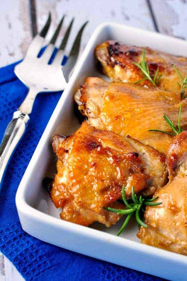 Maple Garlic Glazed Chicken Thighs with a serving fork