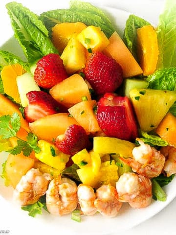 Southwestern Prawn Fruit Salad overhead view with grilled prawns, strawberries and melon