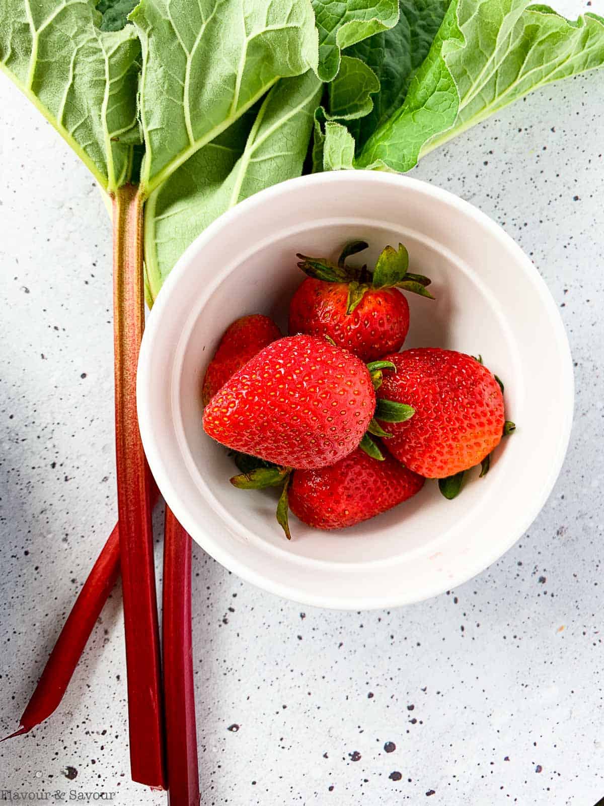 Fresh strawberries and rhubarb stalks