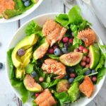 Grilled Salmon Salad with Figs and Blueberries and avocado slices in a bowl. |www.flavourandsavour.com