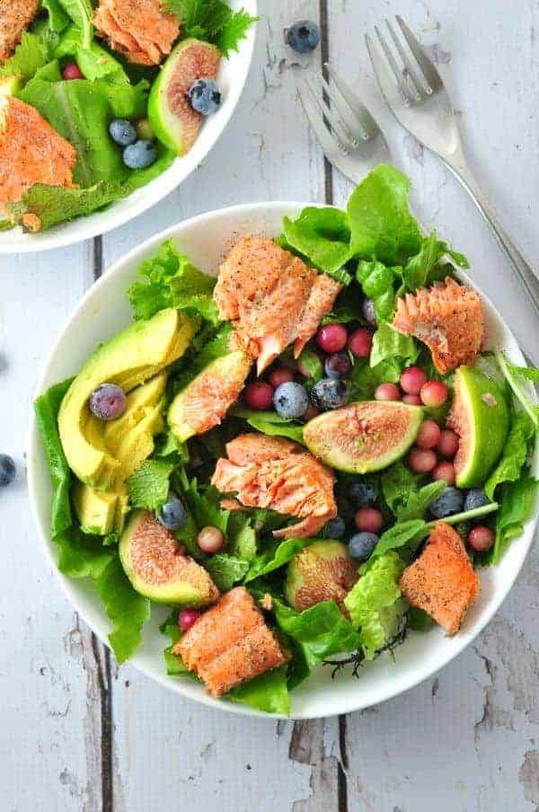 Grilled Salmon Salad with Figs and Blueberries and avocado slices in a bowl. |www.flavourandsavour.com