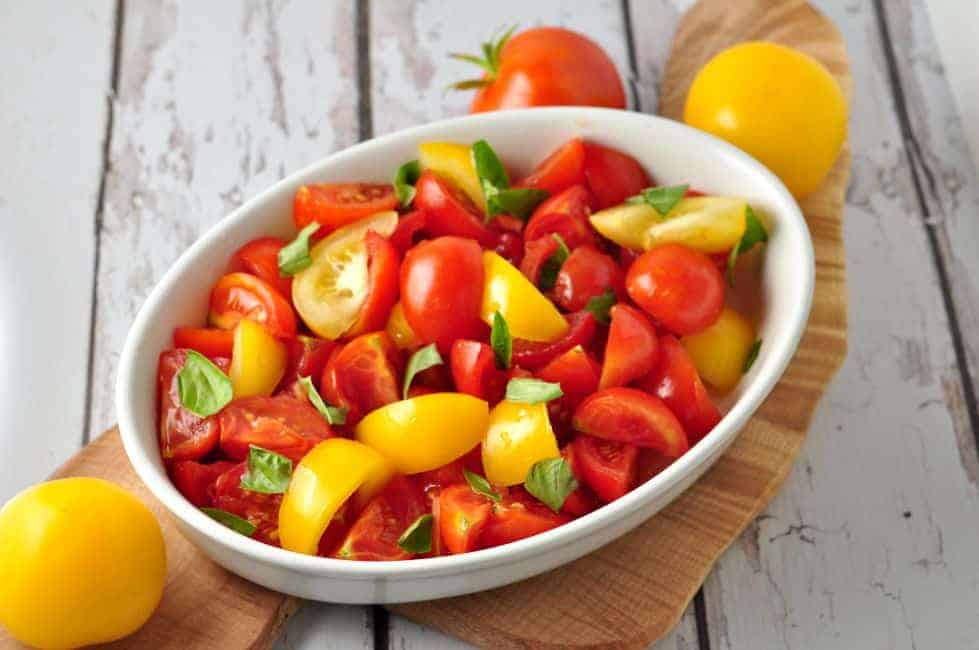 Rustic Tomato Salad with Fresh Basil in a white oval bowl