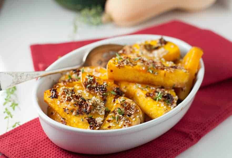Chili Garlic Glazed Butternut Squash garnished with sesame seeds and thyme
