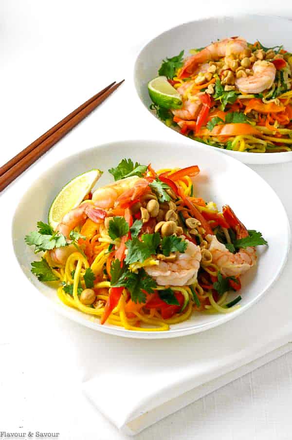 Two bowls of Zoodle Pad Thai with Shrimp with chopsticks