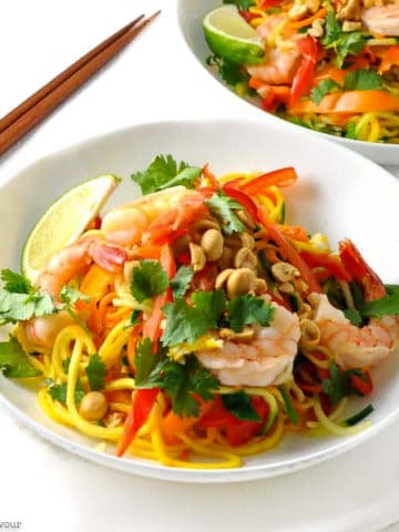 a bowl filled with Shrimp Pad Thai with fresh spiralized vegetables