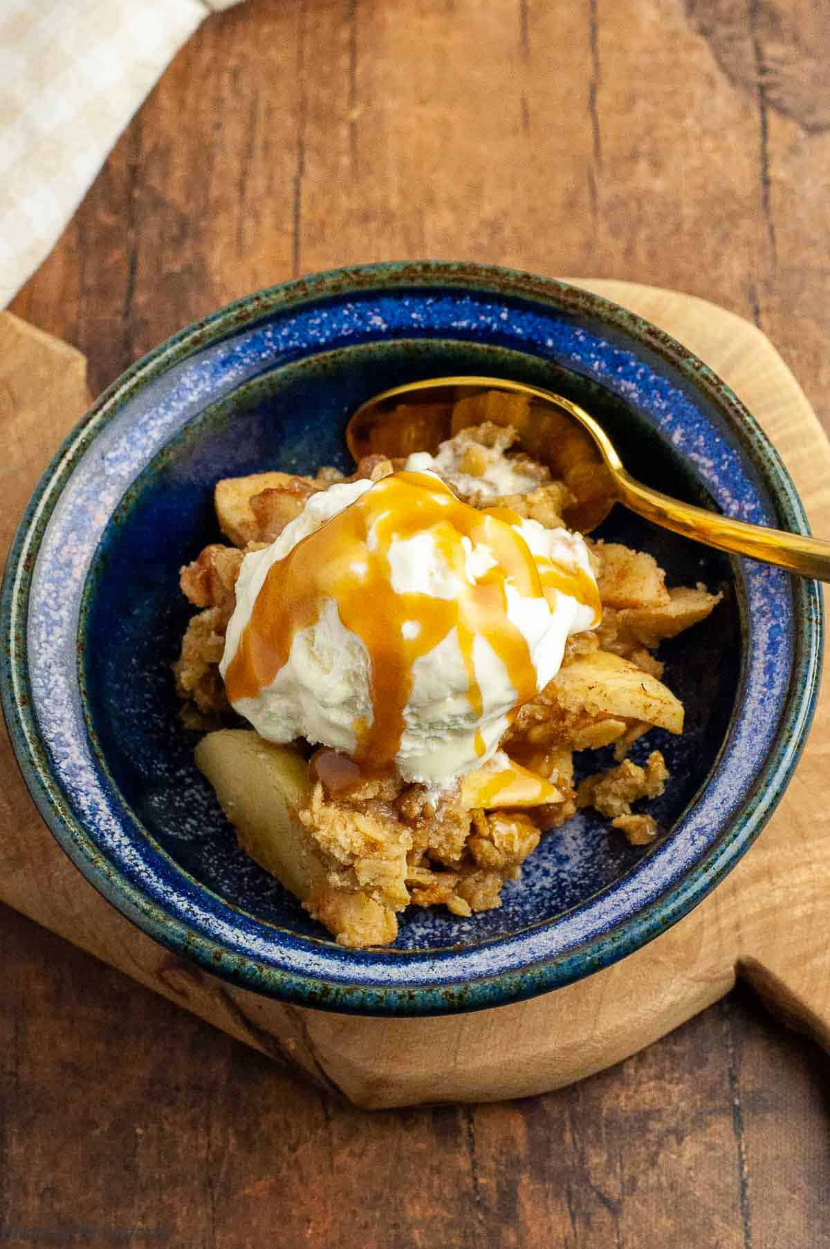 Salted caramel sauce on apple crisp.