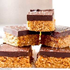 No-bake chocolate peanut butter bars stacked up.