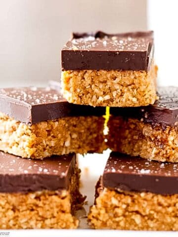 No-bake chocolate peanut butter bars stacked up.