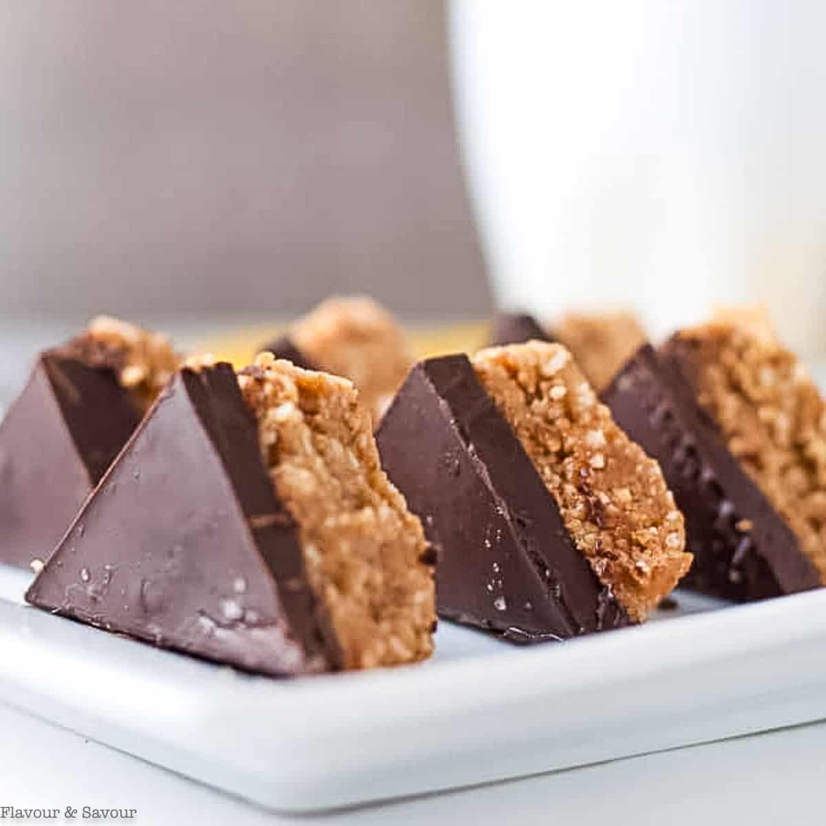 No-bake chocolate peanut butter bars cut in triangle shapes.