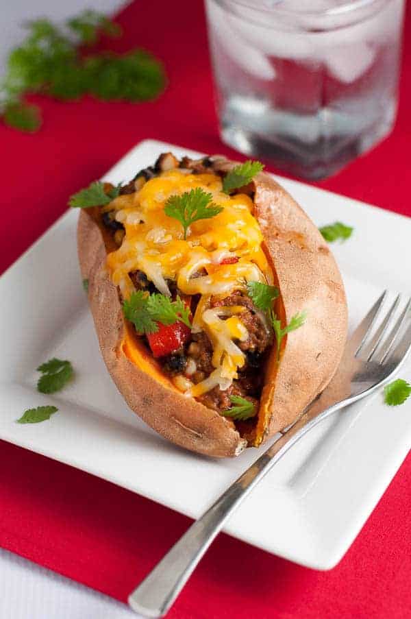 Chipotle Chili Stuffed Sweet Potatoes on a red cloth