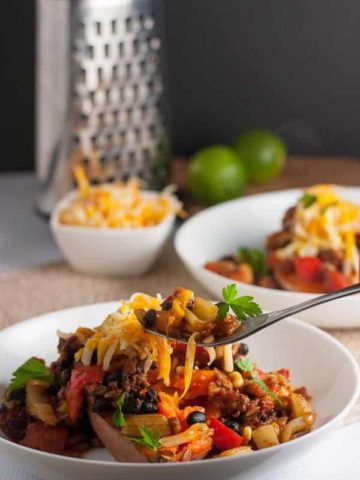 Chipotle Chili Stuffed Sweet Potatoes. A healthy weeknight meal. Fiber-rich tex-mex chili stuffed in a healthy sweet potato., topped with warm melted cheese! |www.flavourandsavour.com