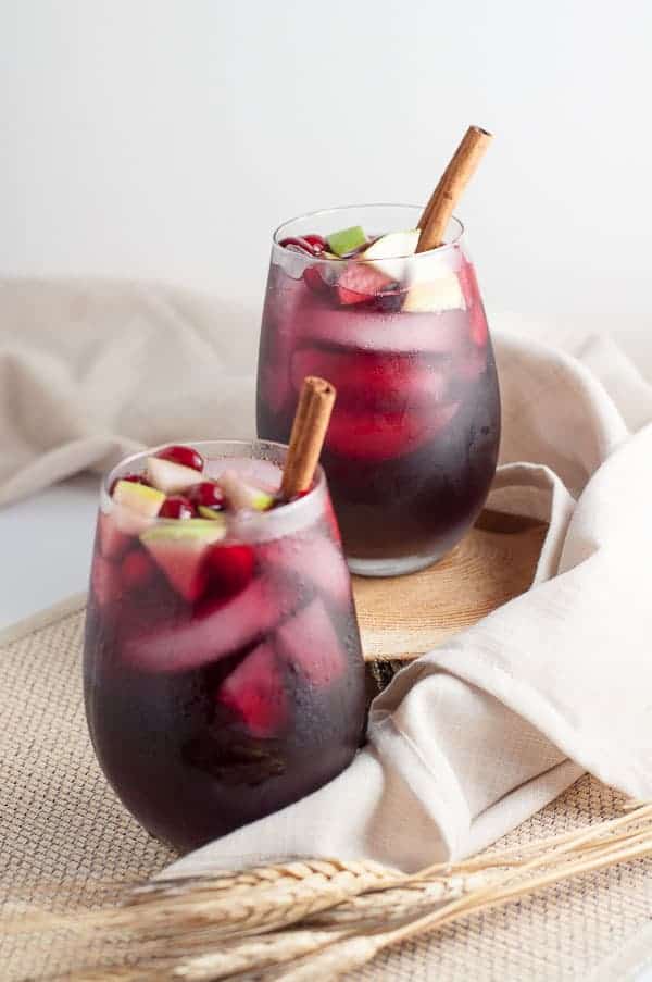 Two glasses of Cranberry Apple Cider Sangria |www.flavourandsavour.com