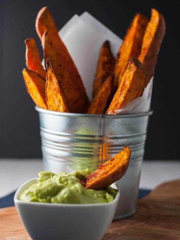 Smoky Sweet Potato Wedges that don't stick to the pan! Discover the secret to crispy fries and potato wedges and never have to scrape them off the pan again. Serve with avocado aioli. |www.flavourandsavour.com