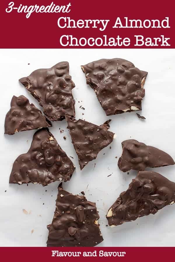 Cherry Almond Chocolate Bark pieces on a white background