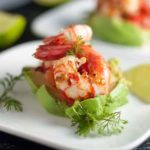 Grilled Chili Lime Shrimp with Fresh Salsa. Easy but impressive appetizer, easily assembled on sliced avocado with a dollop of fresh salsa.