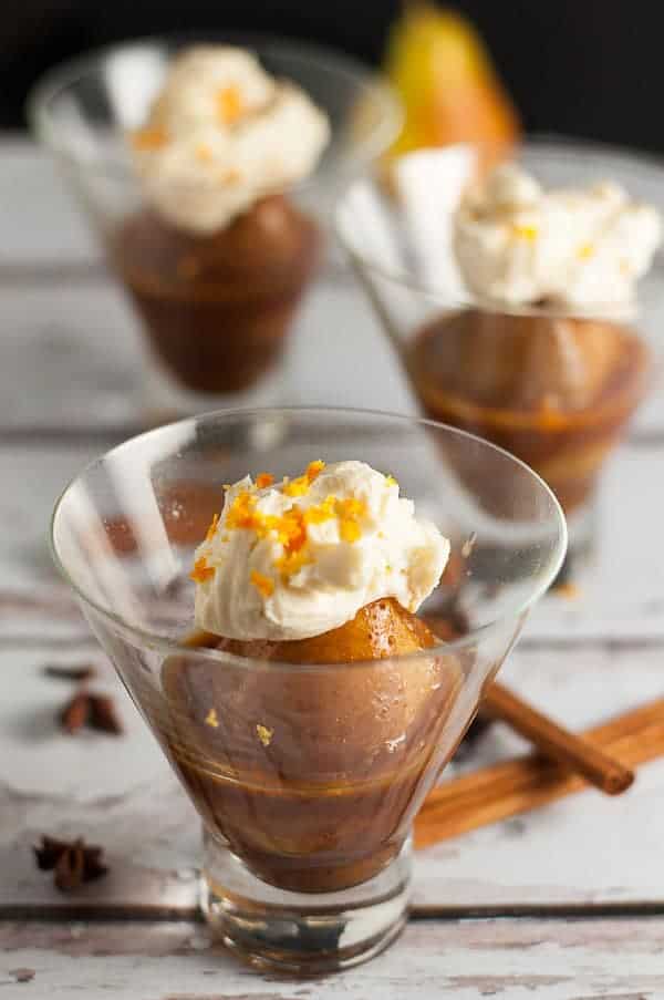 Mulled Cinnamon-Orange Poached Pears with Mascarpone in dessert glasses.