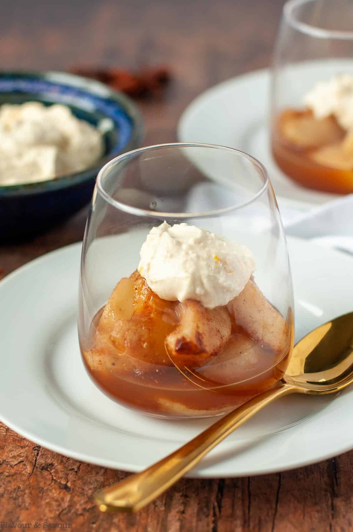 Mulled Cinnamon Orange Pears in a dessert glass with maple mascarpone cheese