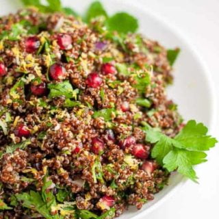 Festive Red Quinoa Tabouli with Pomegranate. A twist on traditional tabouli, this recipe uses red quinoa instead. A healthy salad flavoured with lemon.