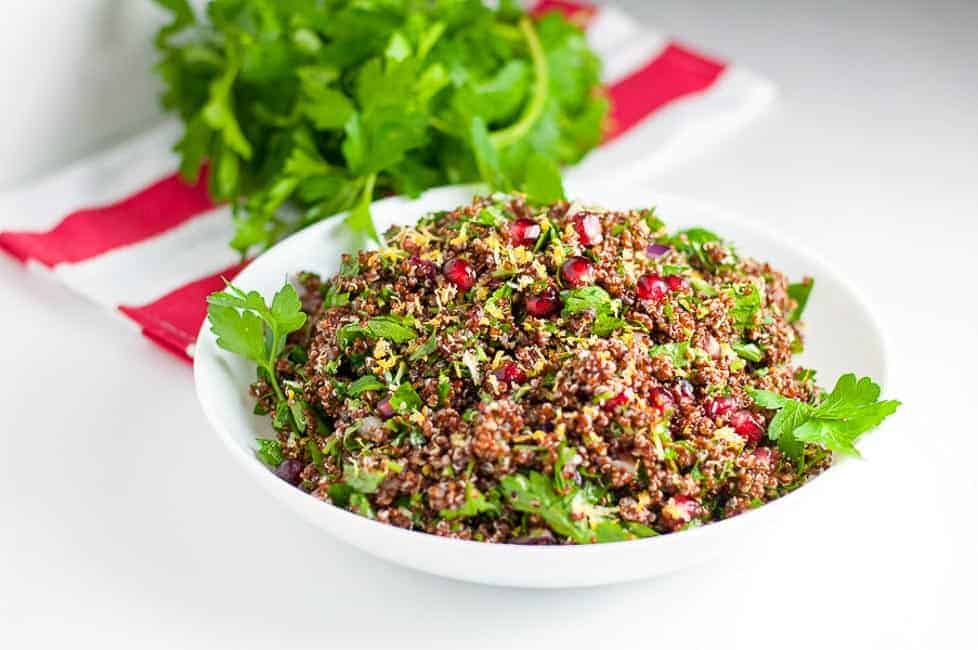 This Red Quinoa Tabouli with Pomegranate is a healthy gluten-free salad for a fall or winter meal. Pomegranate arils give it a festive touch. It has all the flavour of tabouli without the gluten! |www.flavourandsavour.com