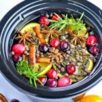 close up view of potpourri spice mix in round slow cooker