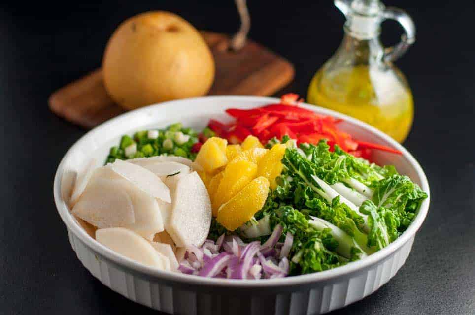Baby Bok Choy Salad with Ginger-Orange Dressing. Add some color to your diet with this healthy salad made with tender baby bok choy, Asian pear, oranges and peppers. Drizzle it all with a ginger-orange dressing. One of 6 Tasty Healthy Winter Salads from Flavour and Savour.