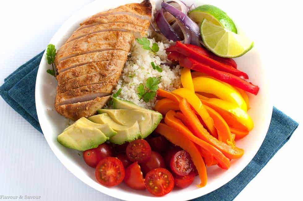 Chicken Fajita Bowl with Cauliflower Rice on a blue napkin