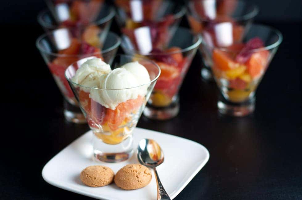  Citrus fruit cup topped with gelato and amaretti cookies.